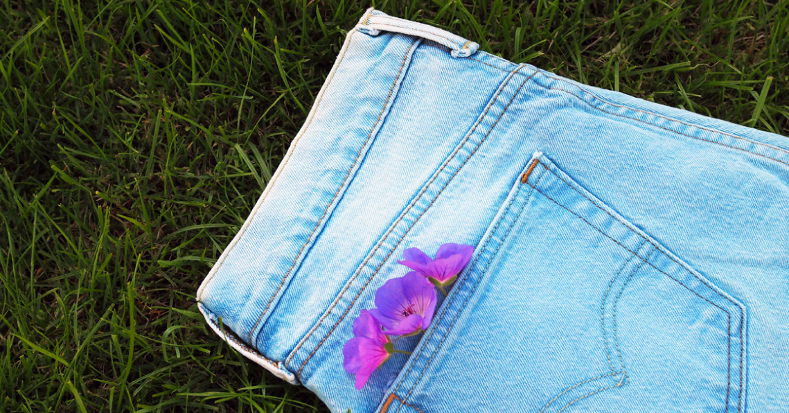 Picture of a pair of jeans on green lawn